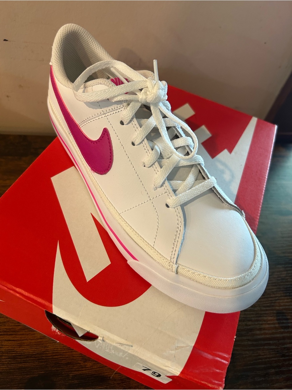 Nike Women’s White Sneaker with Pink Swoosh Accent